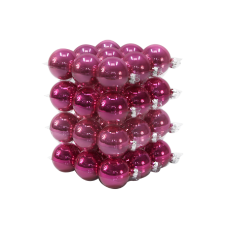 A vibrant stack of shiny magenta ornaments arranged in a neat, layered formation.