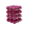 A vibrant stack of shiny magenta ornaments arranged in a neat, layered formation.