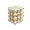 A cluster of shiny cream-colored ornaments arranged in a layered pattern.