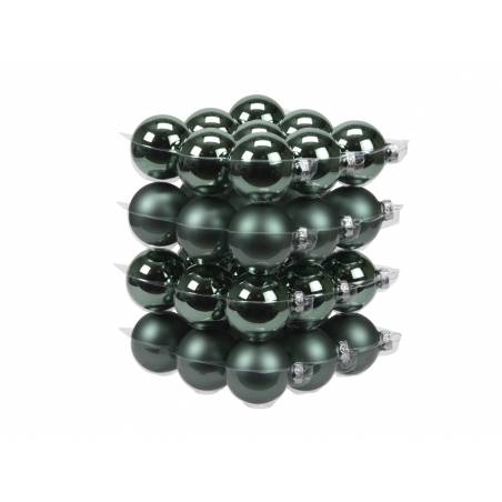 A stack of dark green, glossy Christmas ornaments, round and reflective, arranged neatly.