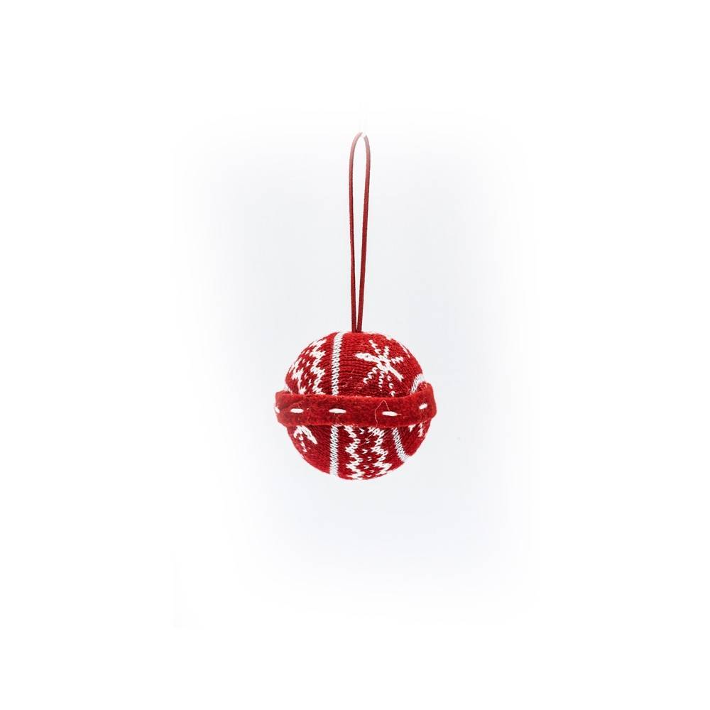 A red knitted ornament with white snowflake patterns, hanging by a red string.