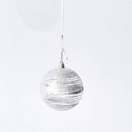 A shimmering silver ornament with textured stripes hanging against a plain white background.