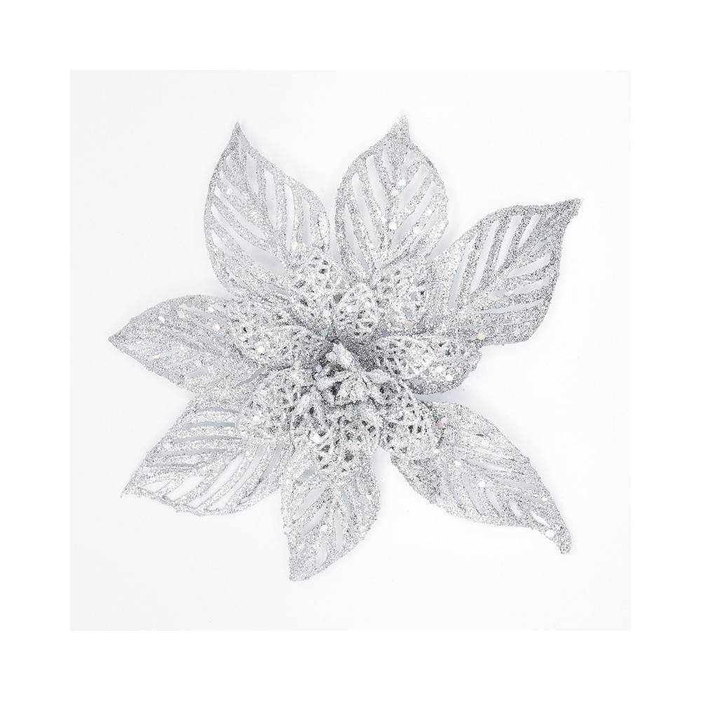 A shimmering silver flower with intricate, lace-like petals and a sparkling center.