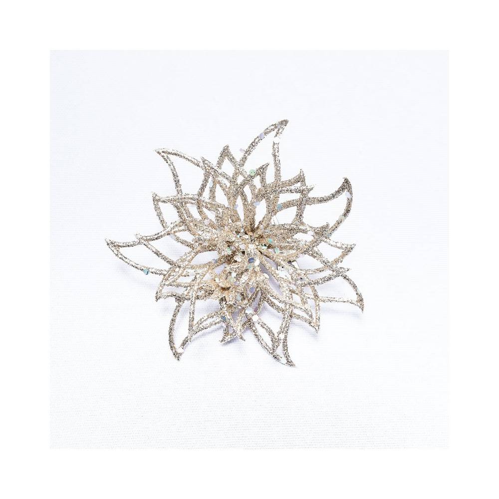 A delicate, shimmering silver flower brooch with intricate petal designs.