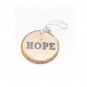 A wooden slice featuring the word "HOPE" carved on it, with a white rope for hanging.