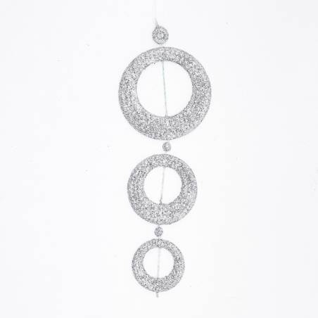 Drie glinsterende cirkels van glitter in aflopende grootte, hangend aan een dunne draad.