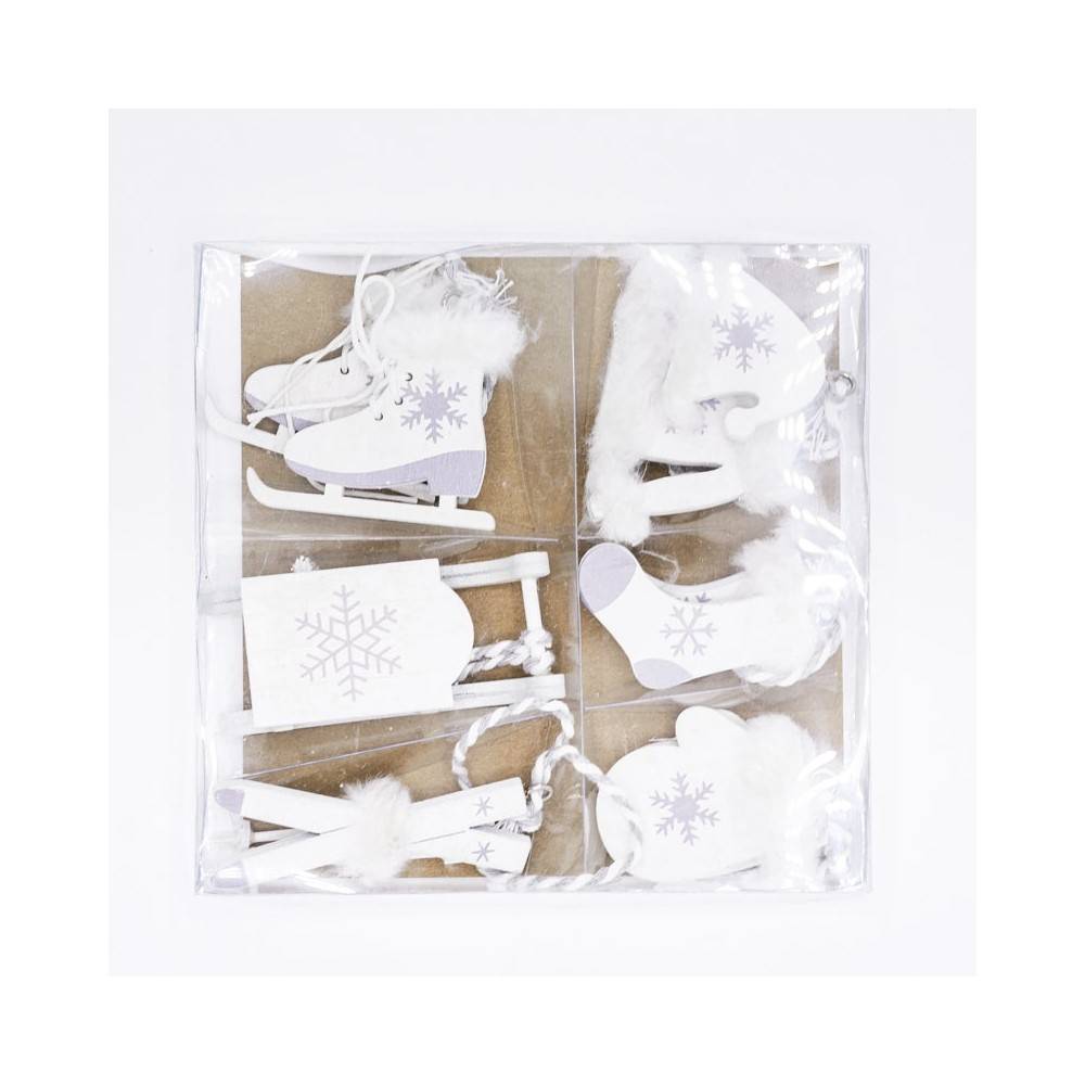 A set of white winter-themed decorations featuring skates, a sled, and cozy boots.