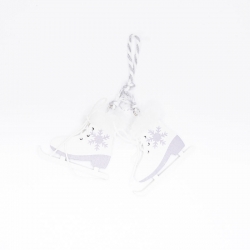 White ice skates with a silver and purple design, hanging by a twisted rope.