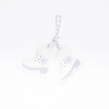 White ice skates with a silver and purple design, hanging by a twisted rope.