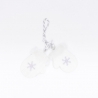Clear plastic mittens with a snowflake, hanging from a twisted string.