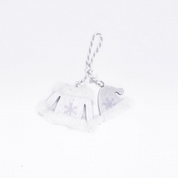 A delicate white sweater ornament with snowflake designs and a silver hanger.