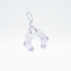 Two small, silver stockings with white fur trim and snowflake designs, hanging from a twine loop.