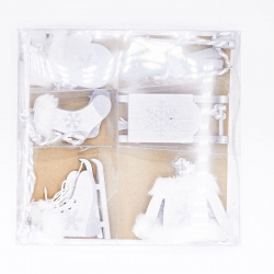 A clear package holds white winter-themed decorations, including skates and a sled.