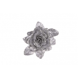 A shimmering silver rose with sparkling petals and leaves against a white background.