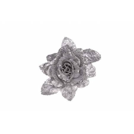 A shimmering silver rose with sparkling petals and leaves against a white background.