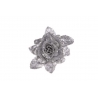 A shimmering silver rose with sparkling petals and leaves against a white background.
