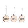 Three wooden slices with twine, each engraved with festive words: XMAS, NOEL, HOPE.