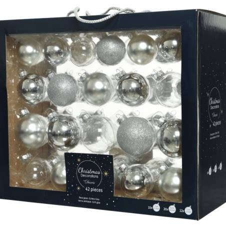 A box filled with silver and glittery Christmas ornaments in various shapes and sizes.