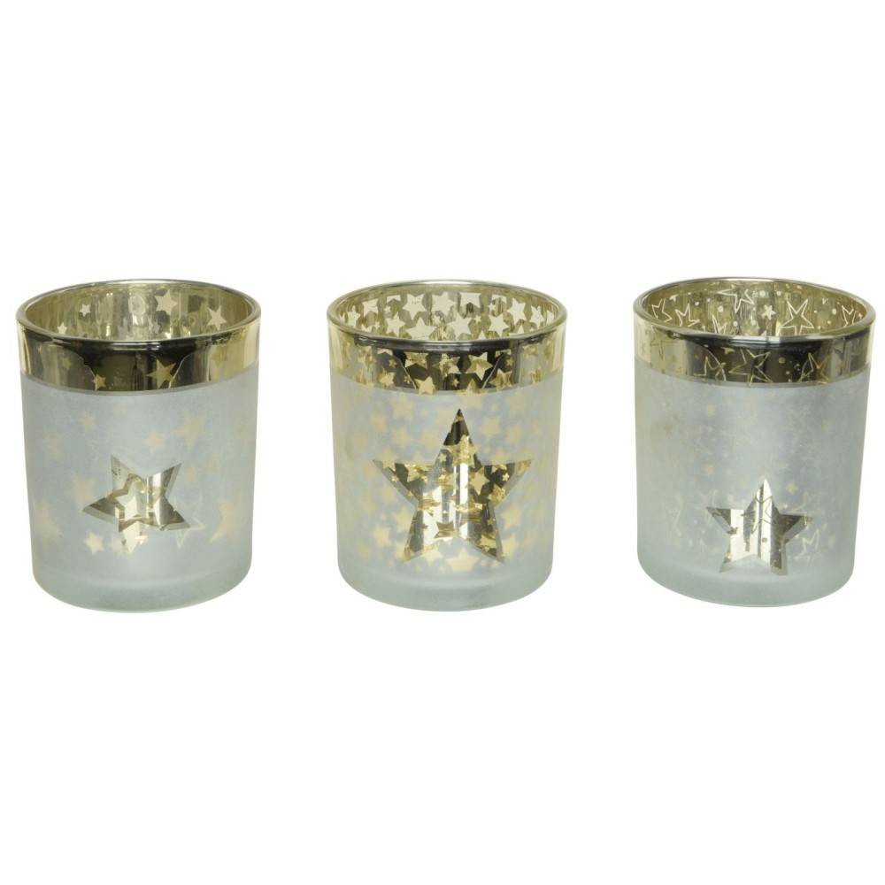 Three frosted glass candle holders with gold star cutouts and shiny gold rims.