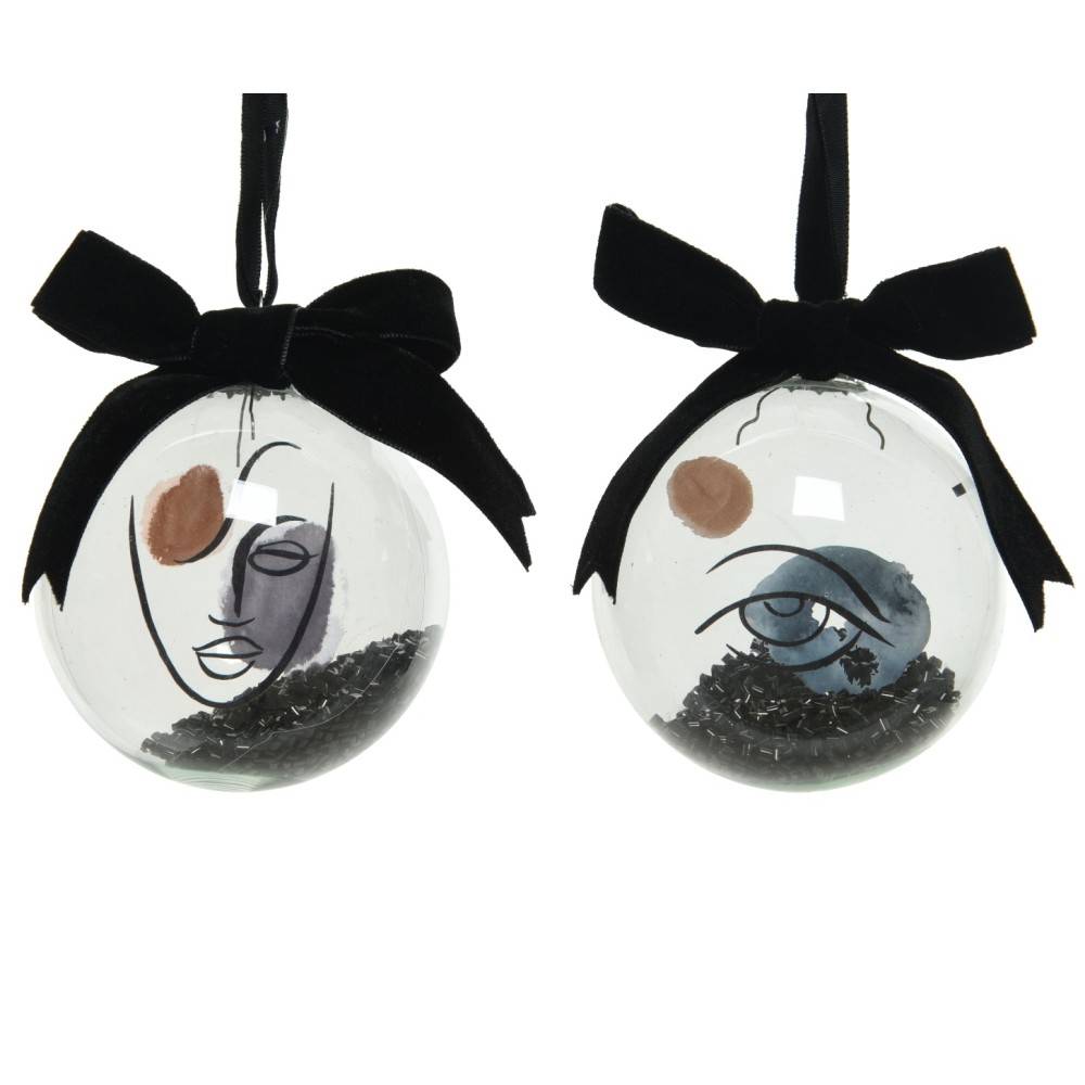 Two glass ornaments with abstract face designs, featuring black and earthy tones and velvet bows.