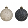 Two spherical ornaments, one cream with gold stripes, the other navy with shimmering patterns.