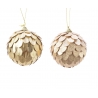 Two shimmering ornaments, one with layered gold scales and the other with a glittery finish.