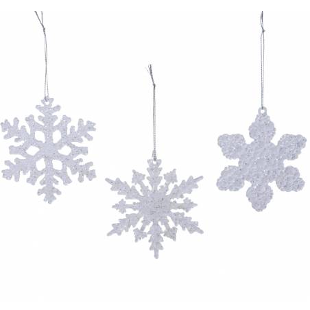 Three white, glittery snowflake ornaments hang, showcasing intricate designs and shimmering surfa...