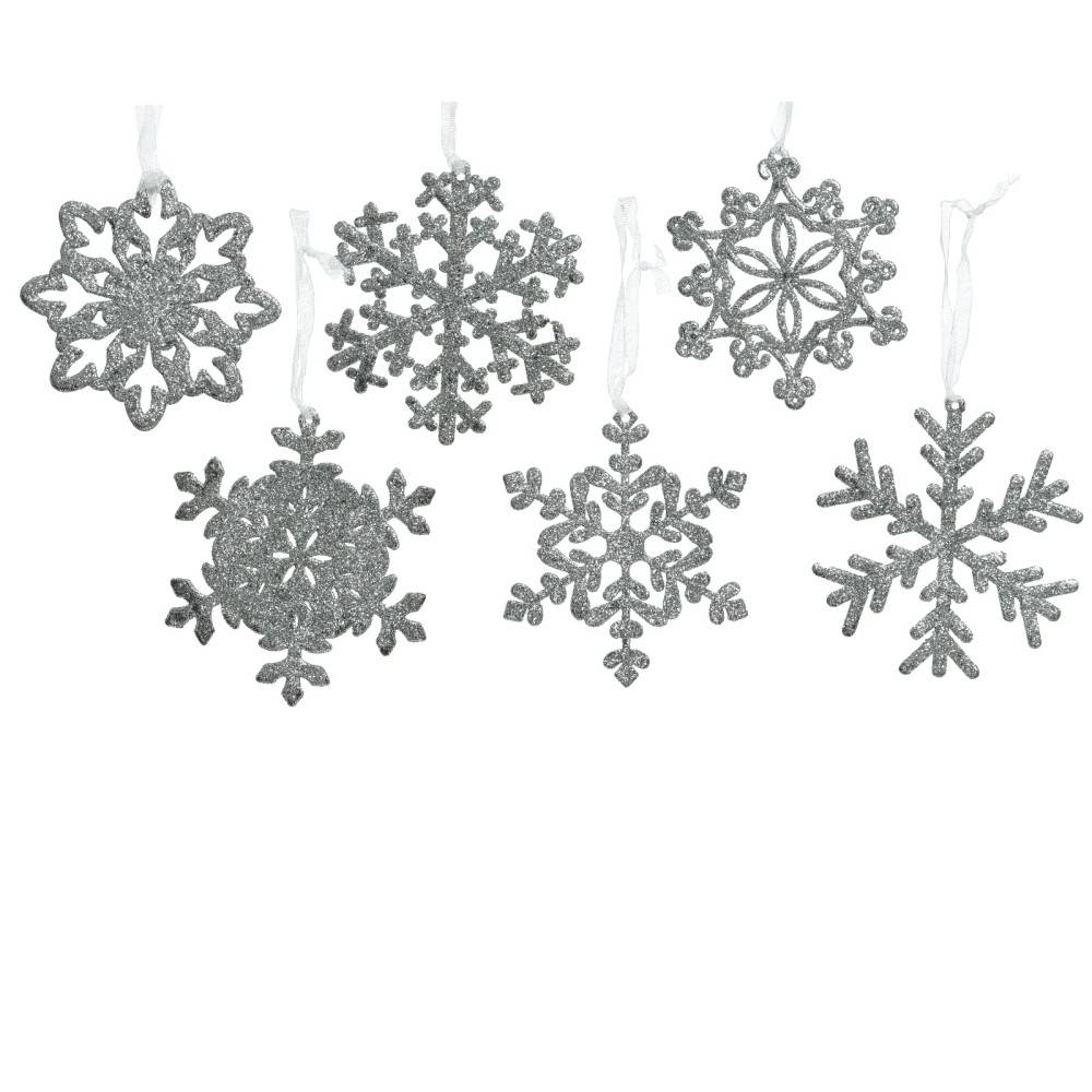 Six shimmering silver snowflake ornaments hanging from thin ribbons against a white background.
