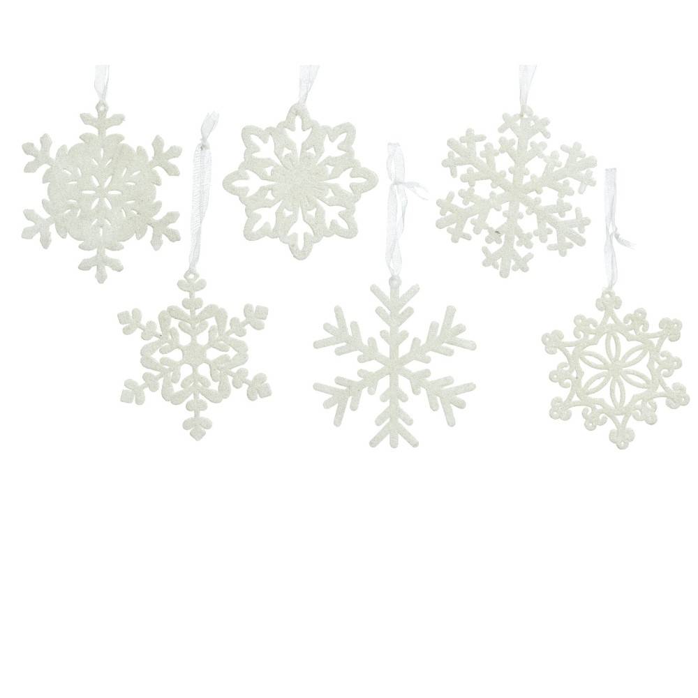 Delicate white snowflake ornaments, each with unique intricate patterns, hang on thin threads.