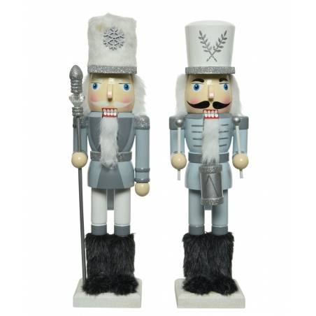 Two decorative nutcrackers in silver and white, with fluffy hats and detailed outfits.