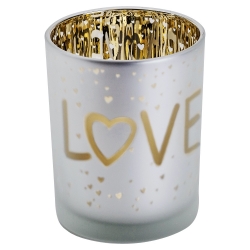 A frosted glass candle holder with a gold interior, featuring the word "LOVE" and tiny hearts.