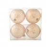 Four delicate, cracked-glass ornaments in a clear box, shimmering with a warm, golden hue.
