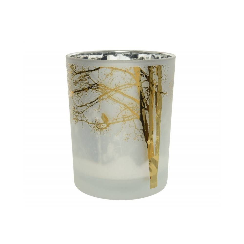 Frosted glass candle holder with golden tree silhouettes and a bird against a soft, misty backgro...