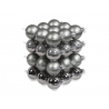 A stacked arrangement of shiny silver and matte gray ornaments in a geometric formation.
