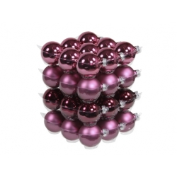 A stack of shiny, deep purple Christmas ornaments arranged in neat layers.
