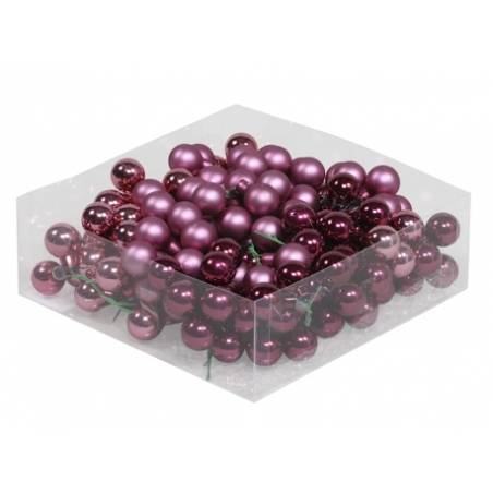 A clear box filled with shiny purple and burgundy decorative beads.