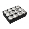A box of twelve shiny silver Christmas ornaments, each round with reflective surfaces.