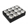 A box containing twelve shiny silver Christmas ornaments with striped patterns.