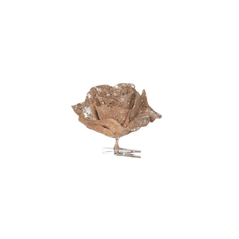 A sparkling brown rose made of textured material, attached to a clear clip.