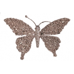 A shimmering butterfly shape embellished with sparkling gemstones and a metallic finish.