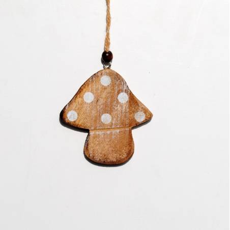 A rustic wooden mushroom ornament with white polka dots and a natural twine hanger.