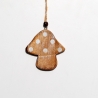 A rustic wooden mushroom ornament with white polka dots and a natural twine hanger.