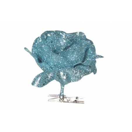 A shimmering blue rose made of glitter with delicate petals and a silver clip.