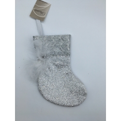 A shimmering silver stocking adorned with glitter and a delicate white feather.