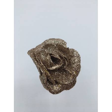 A sparkling gold rose crafted from glittering material, exuding elegance and charm. A sparkling gold rose crafted from glittering material, exuding elegance and charm.