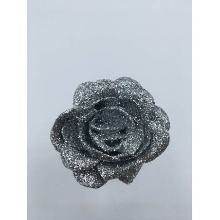 A sparkling silver rose with glittery petals, showcasing a delicate and elegant design. A sparkling silver rose with glittery petals, showcasing a delicate and elegant design.