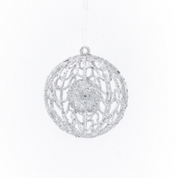A delicate silver ornament with intricate lace-like patterns, shimmering against a white background.