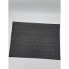 A dark gray placemat with a subtle textured pattern, rectangular in shape.