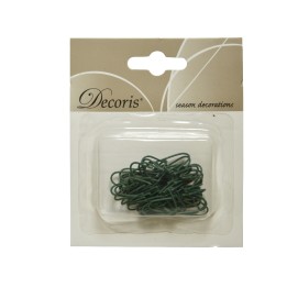 Groene decoratieve draadjes in een doorzichtige verpakking met een beige achtergrond.