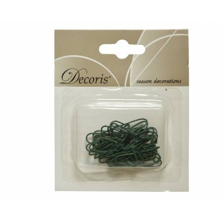 A pack of green decorative wires in a clear plastic container on a light beige background.